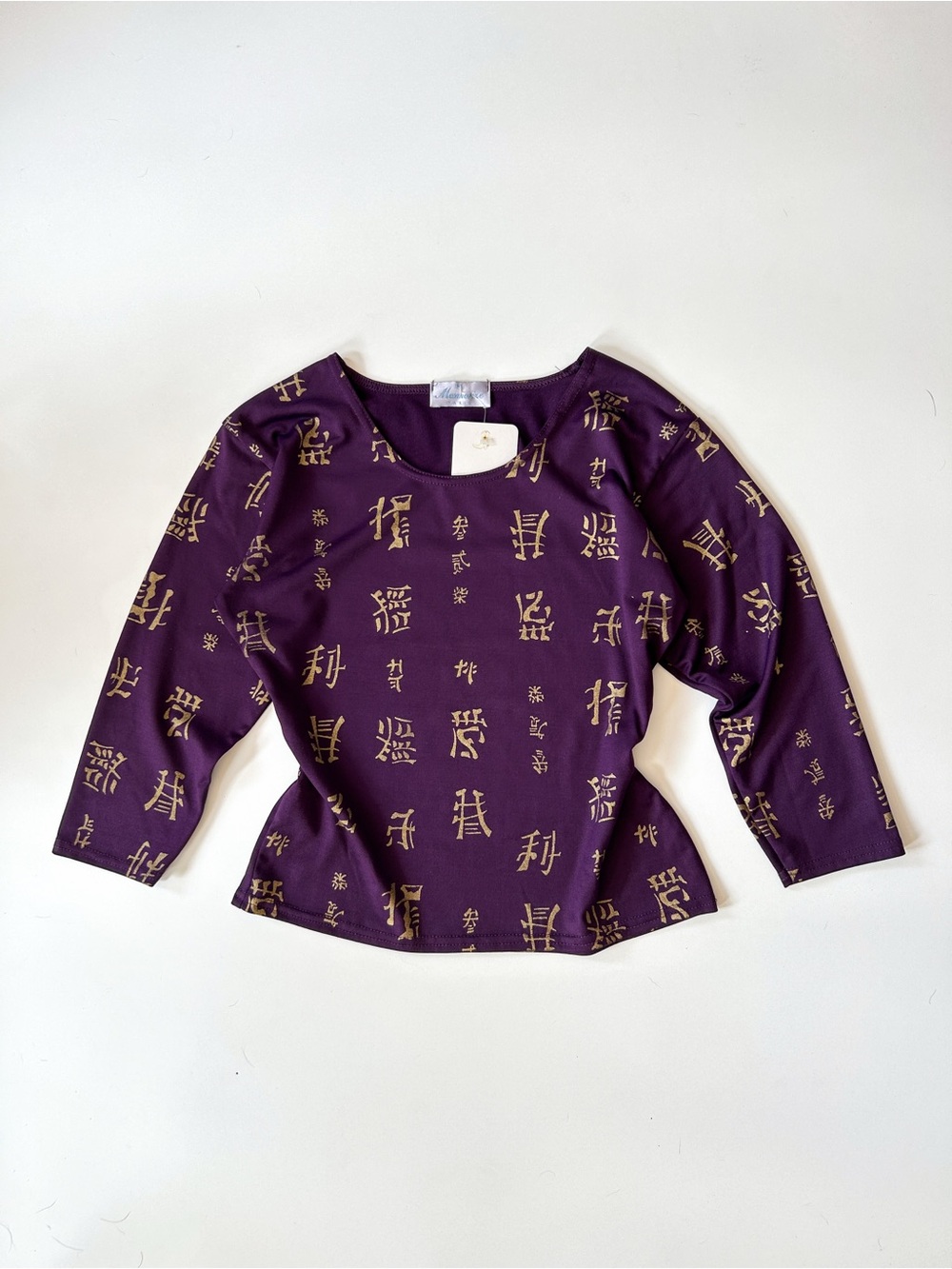 Vintage Purple Long-Sleeve Top with Gold Character Print